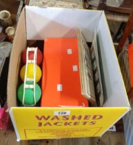 A shoebox containing a quantity of vintage badges, etc. - sold with child's boules set and a