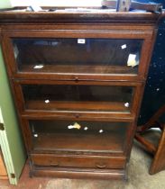 An 86.5cm vintage oak modular bookcase with cornice and long drawer to base - minor damp swelling to