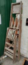 Two vintage wooden stepladders