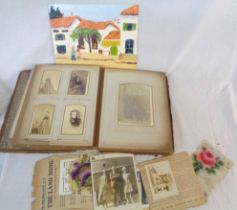 A damaged Victorian cabinet album containing cartes de visite, posed photographic images and other