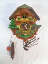 A tourist ware cuckoo wall clock with single weight driven movement