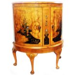 A 76cm 20th Century mixed wood bow front chinoiserie decorated cabinet with glass shelf enclosed