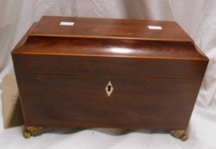 A 19th Century sarcophagus rosewood and mixed wood tea caddy with mixing bowl, brass feet and