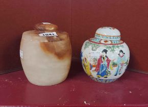 An old Chinese porcelain ginger jar and lid with famille rose decoration - sold with an alabaster