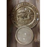 A large embossed brass tray with galleon decoration - sold with a smaller Eastern chased brass