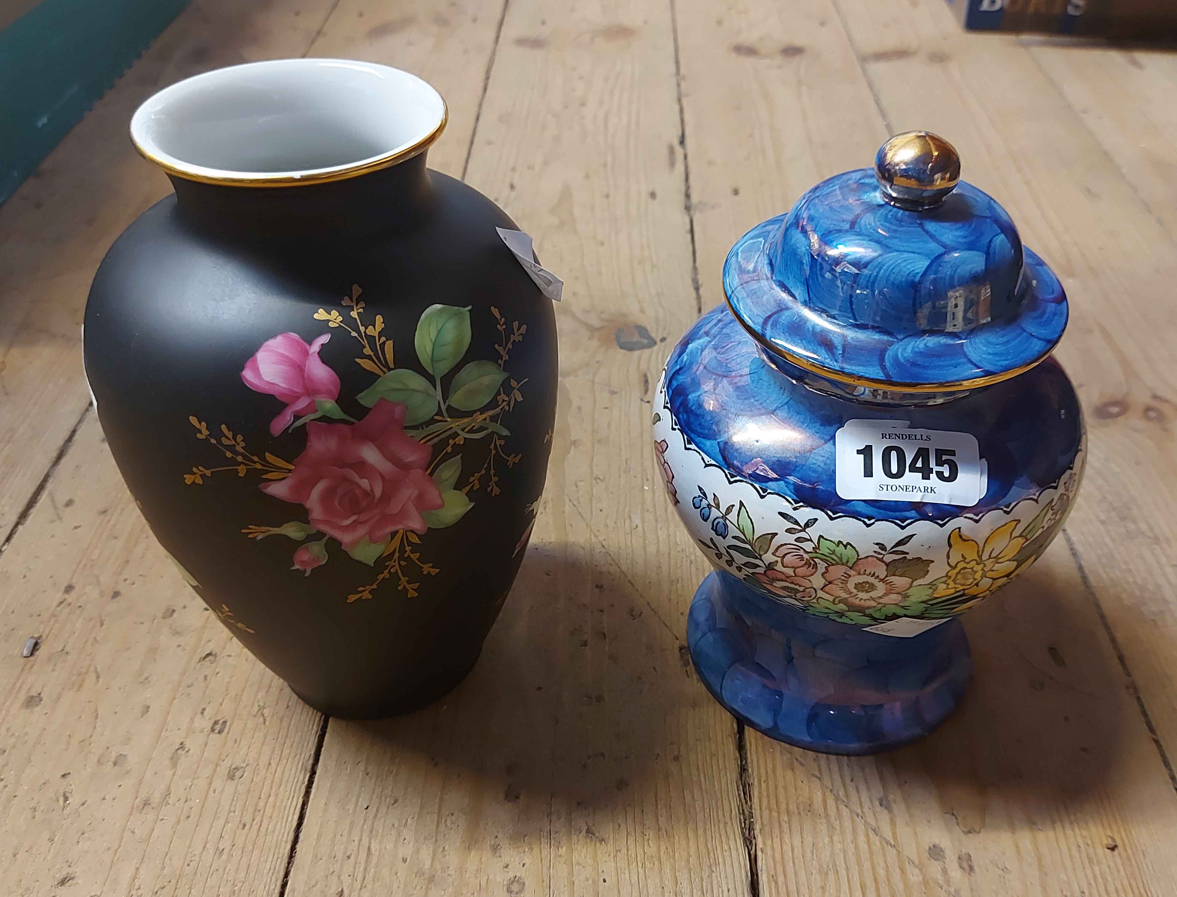 A Maling pottery lidded jar with decorative floral band on a blue sponged ground - sold with a