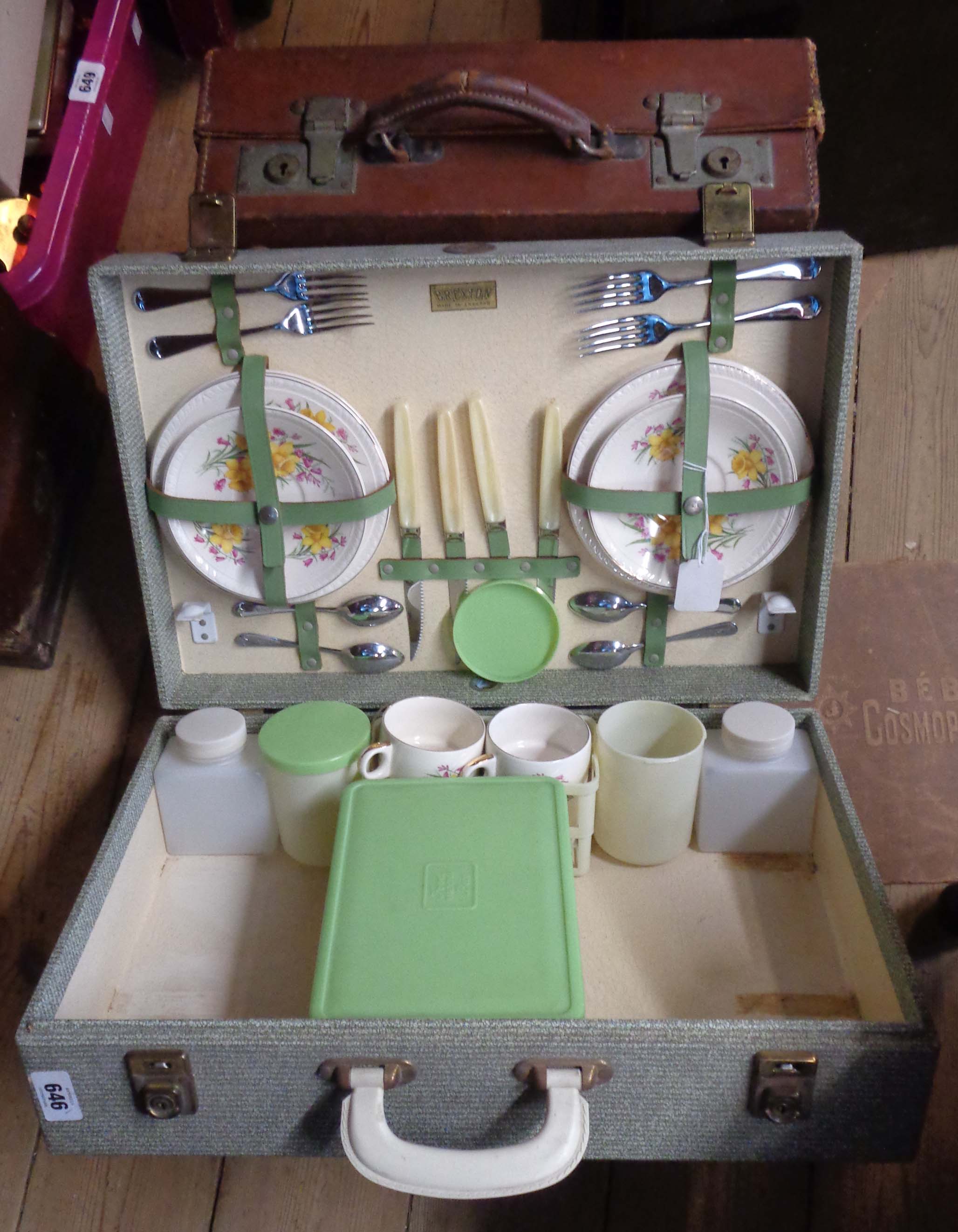 A vintage Brexton picnic case with ceramic plates and cups - sold with a small leather case