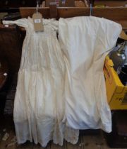 Three antique christening gowns including silk and other examples