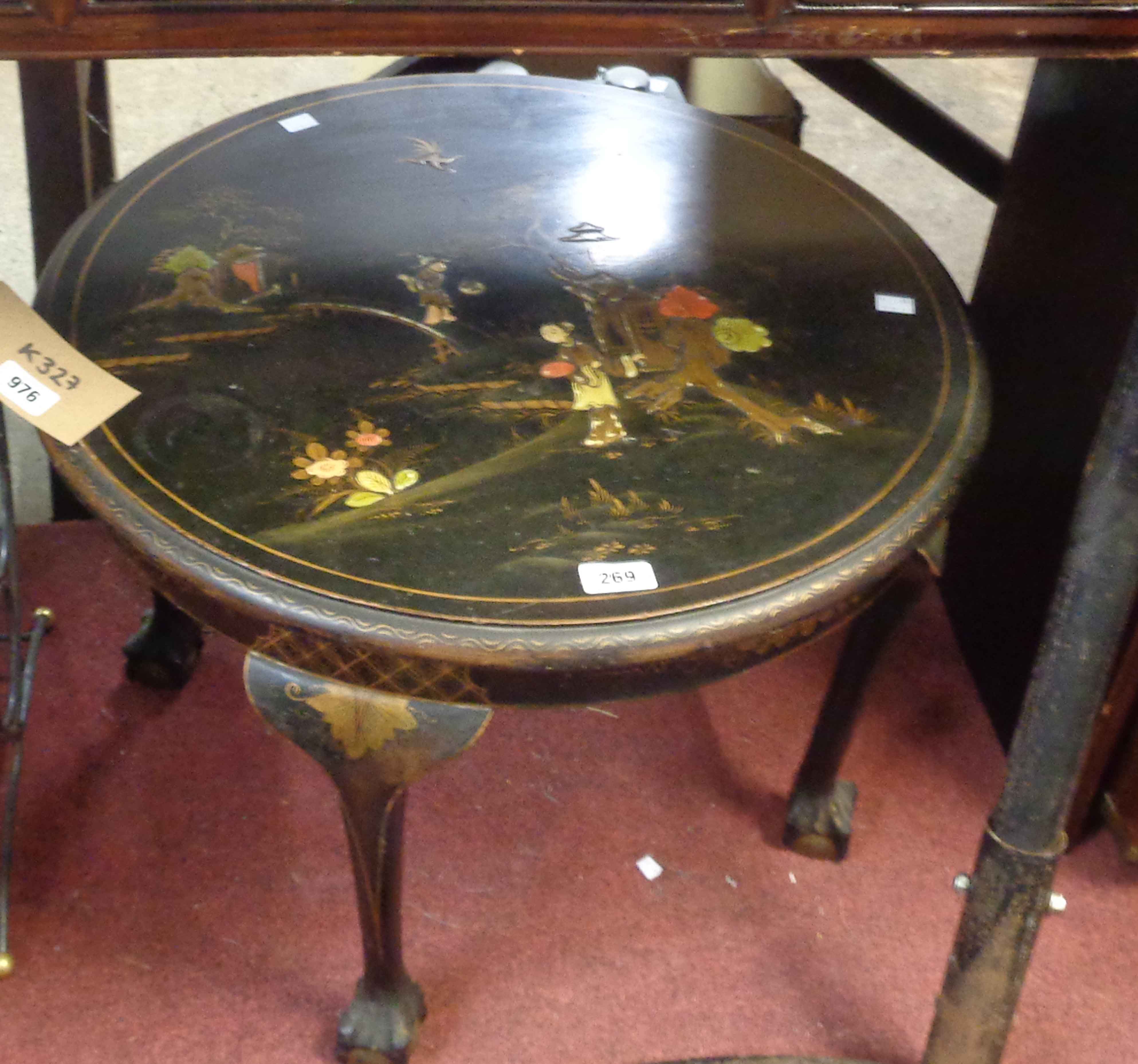 A 61cm diameter early 20th Century tea table with painted chinoiserie decoration on black ground,