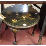 A 61cm diameter early 20th Century tea table with painted chinoiserie decoration on black ground,