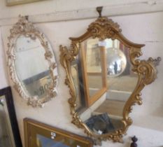 A vintage plaster and parcel gilt framed oval wall mirror - sold with gilt resin Rococo style