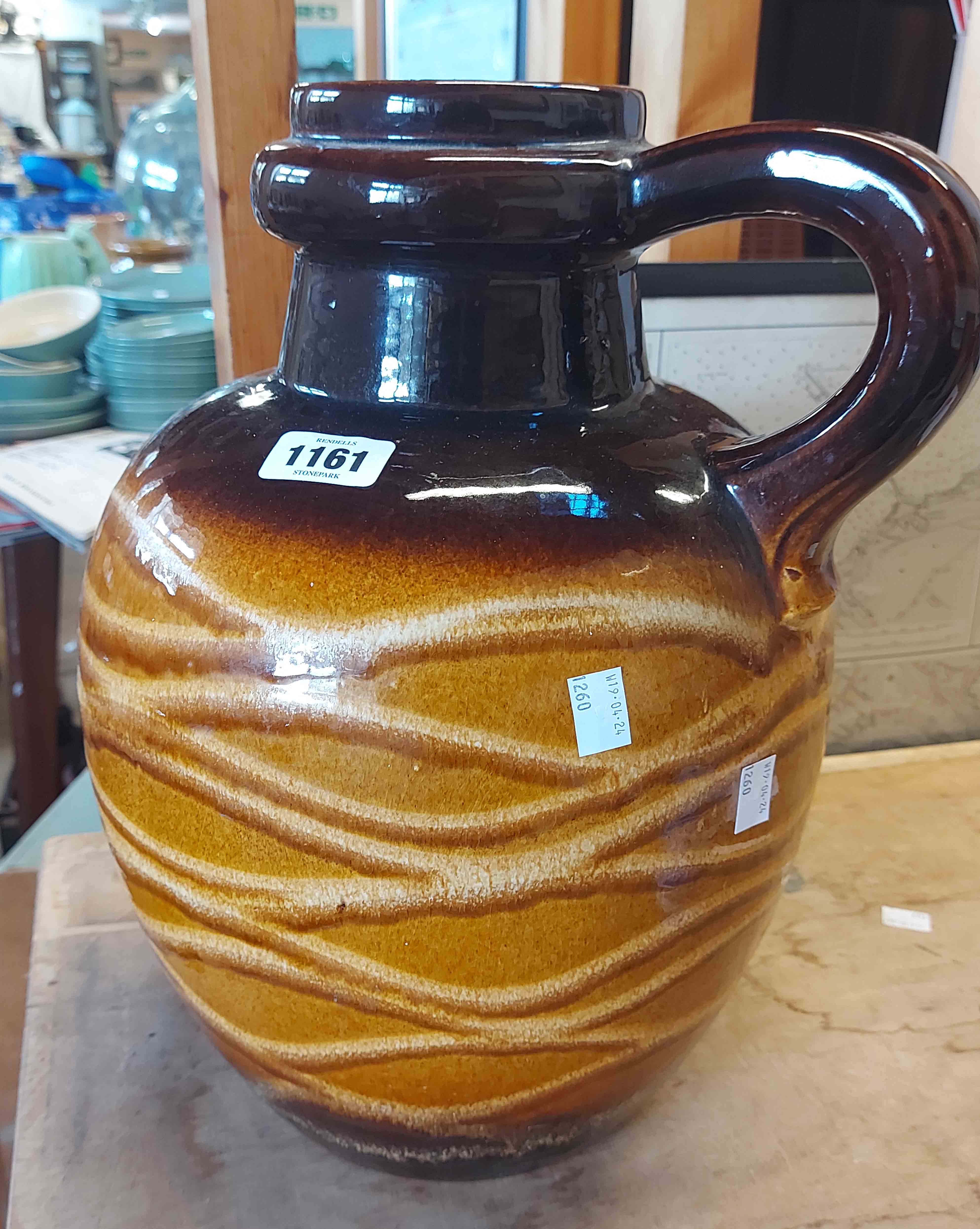 A large mid 20th Century West German pottery vase of globular jug form with slip trailed