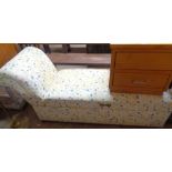 A 1.45m 20th Century ottoman daybed with printed upholstery, set on casters