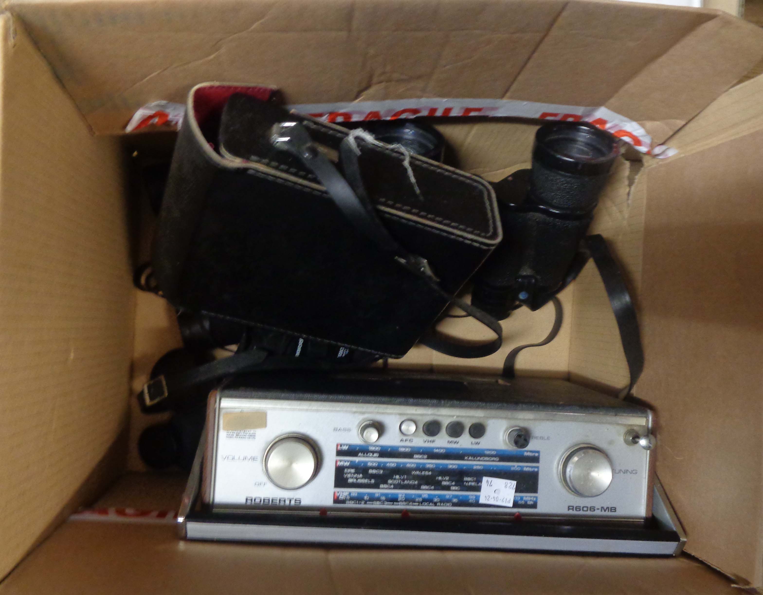 A vintage Roberts R606/MV radio - sold with three pairs of binoculars