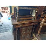 A 98cm late Victorian oak chiffonier with profuse carved decoration to raised back, single frieze