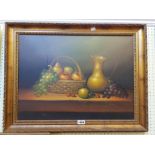 Dick: a gilt framed oil on canvas still life with ewer and basket of fruit on a table - signed