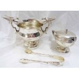 A small silver footed bowl with flanking cast gryphon pattern handles - Sheffield 1911 - sold with a