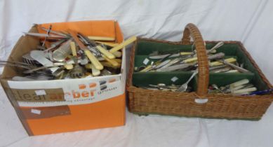 A box and a wicker basket containing a quantity of assorted silver plated and other cutlery