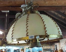A large vintage brass fitted hanging lamp with animal hide shade