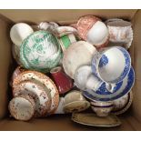 A box containing a quantity of bone china trios, various factories and form