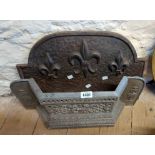 An old cast metal fire grate front - sold with a similar cast iron fire back with fleur de lys