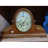 A large vintage oak cased Napoleon hat mantel clock with Arabic numerals and Junghans eight day