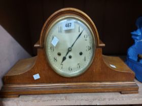 A large vintage oak cased Napoleon hat mantel clock with Arabic numerals and Junghans eight day