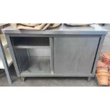 A stainless steel kitchen cabinet - sold with a large kitchen draw unit and a shelf unit