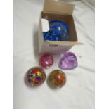 Five glass paperweights including Caithness, etc.