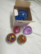 Five glass paperweights including Caithness, etc.