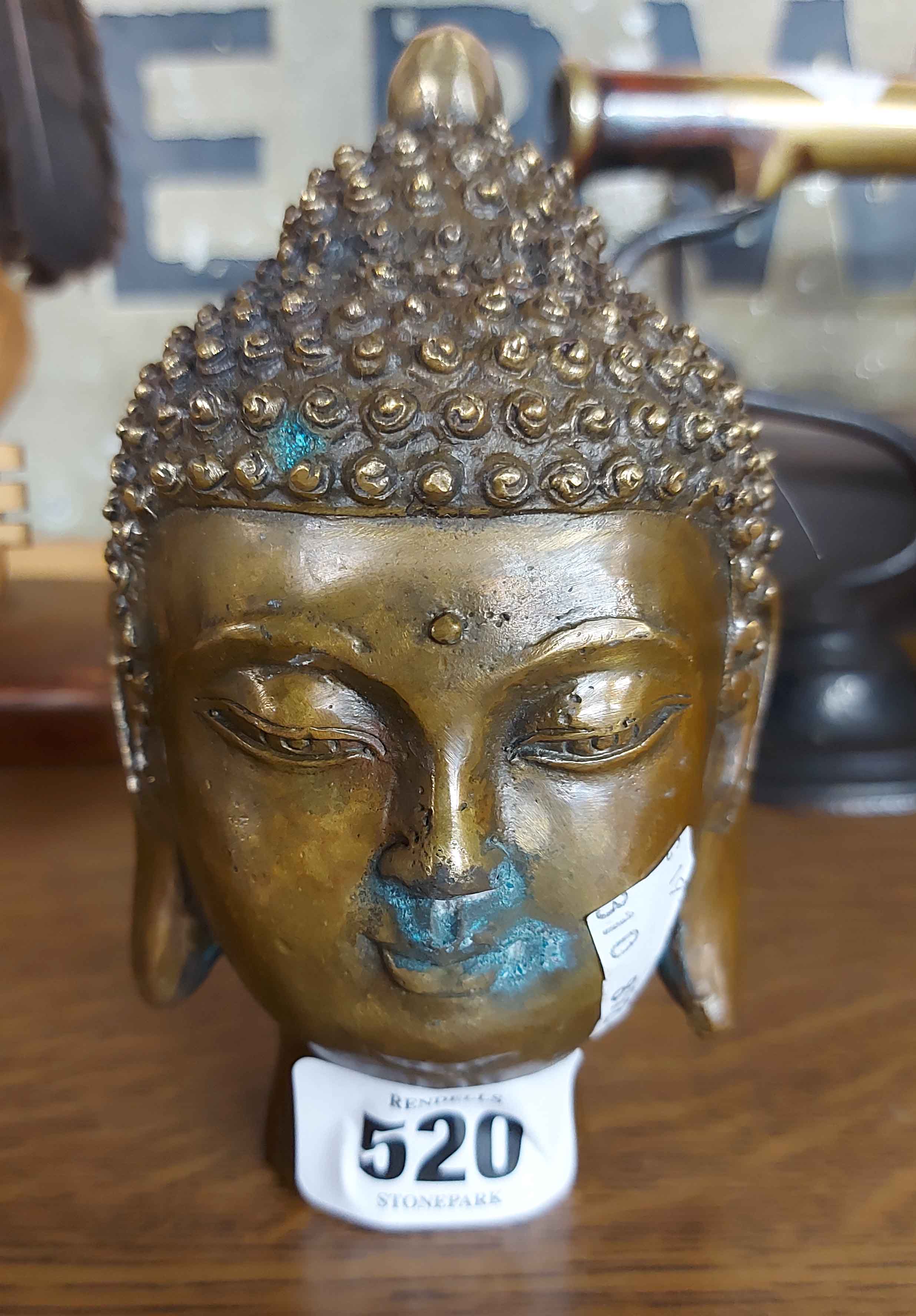 A modern brass Buddha head