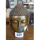 A modern brass Buddha head