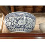 A large Chinese porcelain punch bowl with blue painted floral decoration