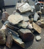 A quantity of large stones including granite, Yelverton stone, etc.