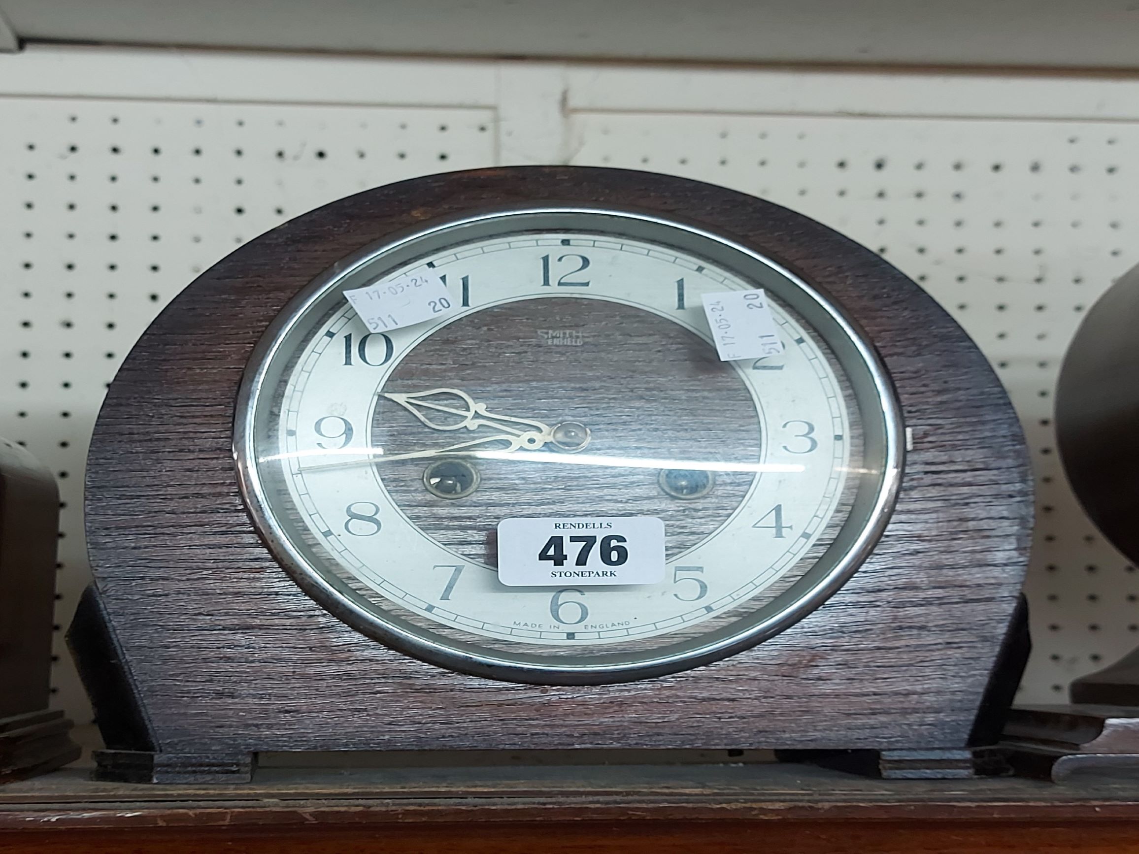 A vintage Smiths oak cased mantel clock with eight day gong striking movement