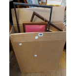 A box containing a quantity of picture frames of various size