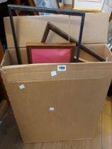 A box containing a quantity of picture frames of various size
