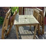 A teak garden table and chairs