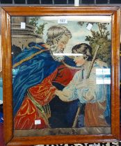 A vintage framed embroidery, depicting the Prodigal son