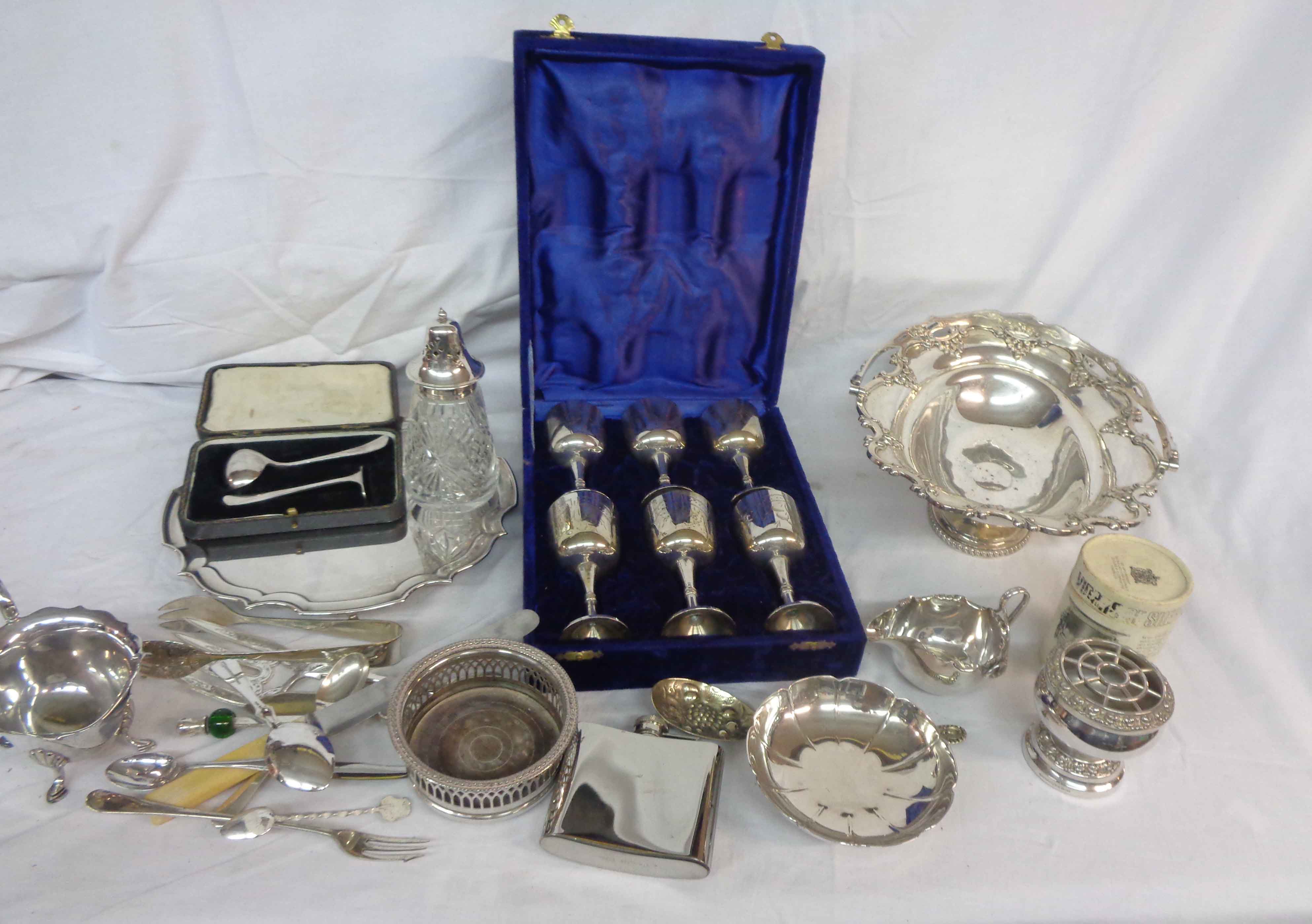 A box containing a quantity of silver plated items including swing handled cake basket, tea tray,