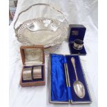 A cased silver spoon with initials to terminal, cased pair of silver napkin rings with 'V'