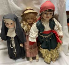 Three vintage porcelain dolls comprising a nun, Gypsy Rose and another