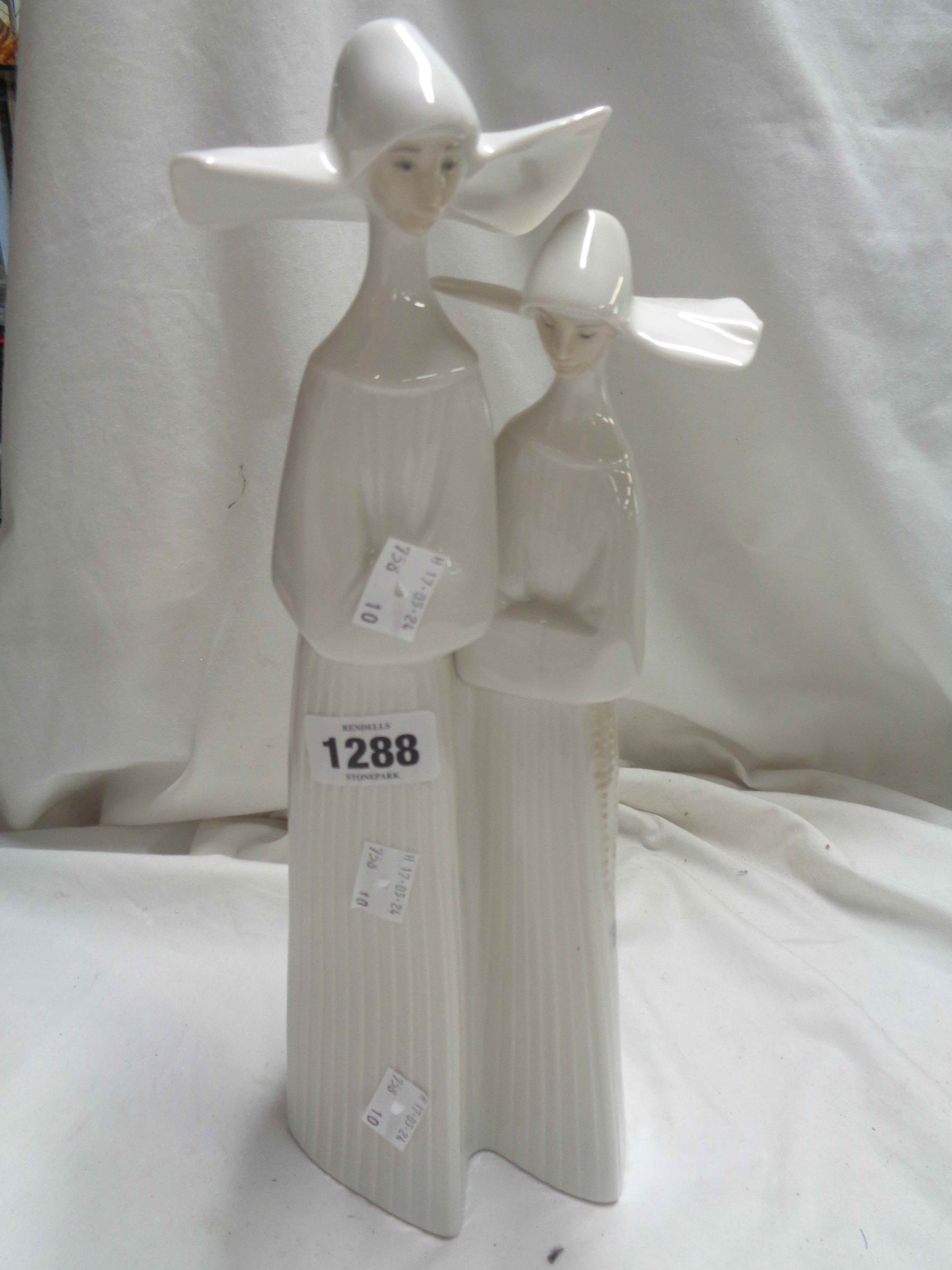 A Lladro porcelain figurine, depicting two nuns