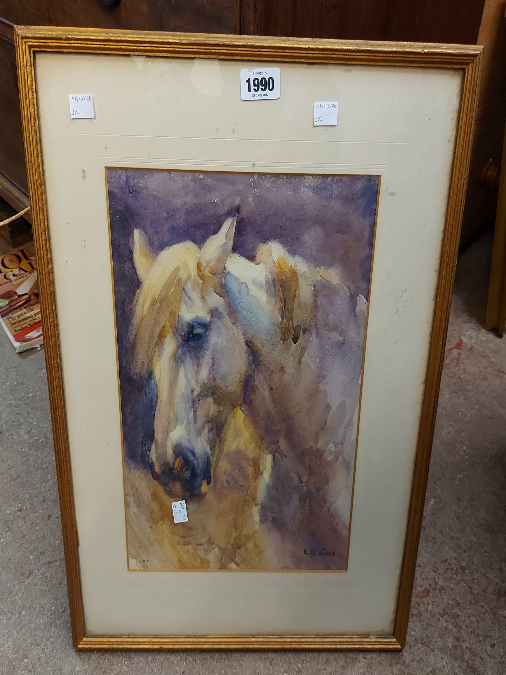 †L.B. Ewan: a framed watercolour study of a horse - signed and with details verso