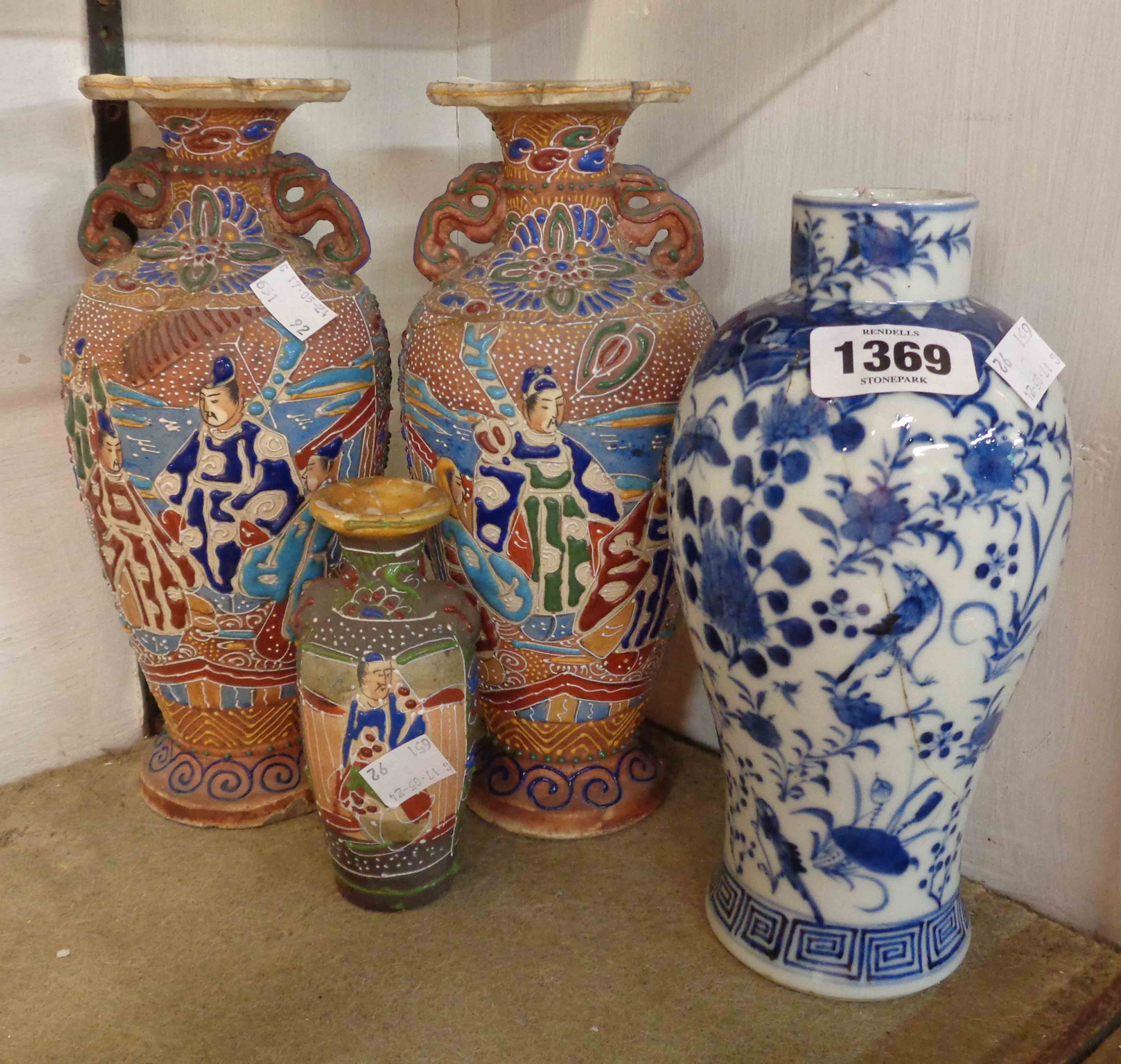 An antique Chinese porcelain vase with hand painted decoration in blue, depicting birds amidst