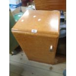 A pair of vintage bird's-eye maple veneered bedside pot cupboards with composite handles, set on