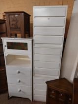 A modern white painted wood bedroom suite comprising 64cm chest of three drawers with stained