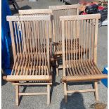 Four folding teak garden chairs