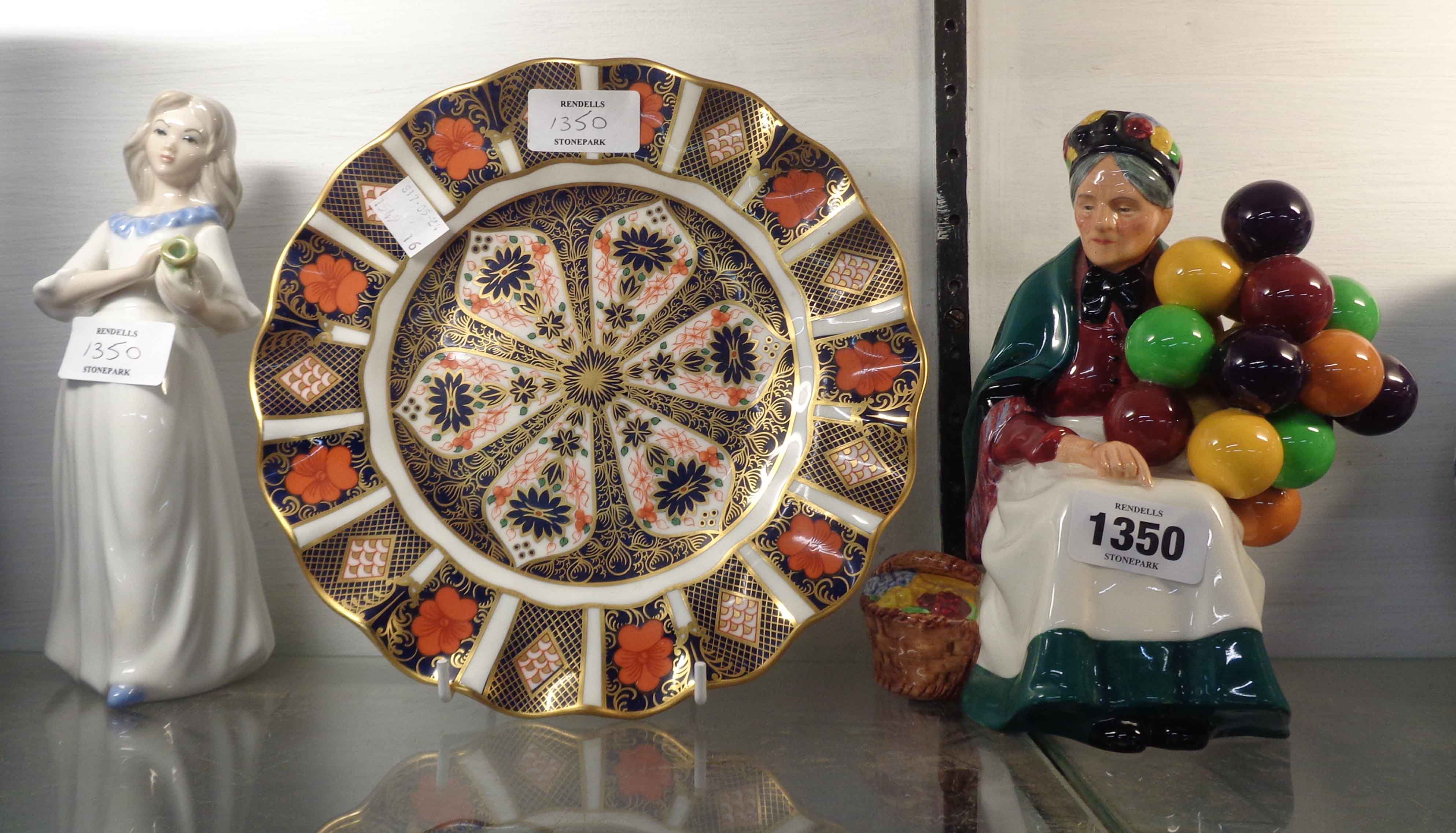 A Royal Doulton figurine 'The Old Balloon Seller' HN 1315 - sold with a Royal Crown Derby plate