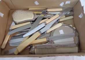 A vintage silver plated three piece dressing table hand mirror and brush set - sold with a